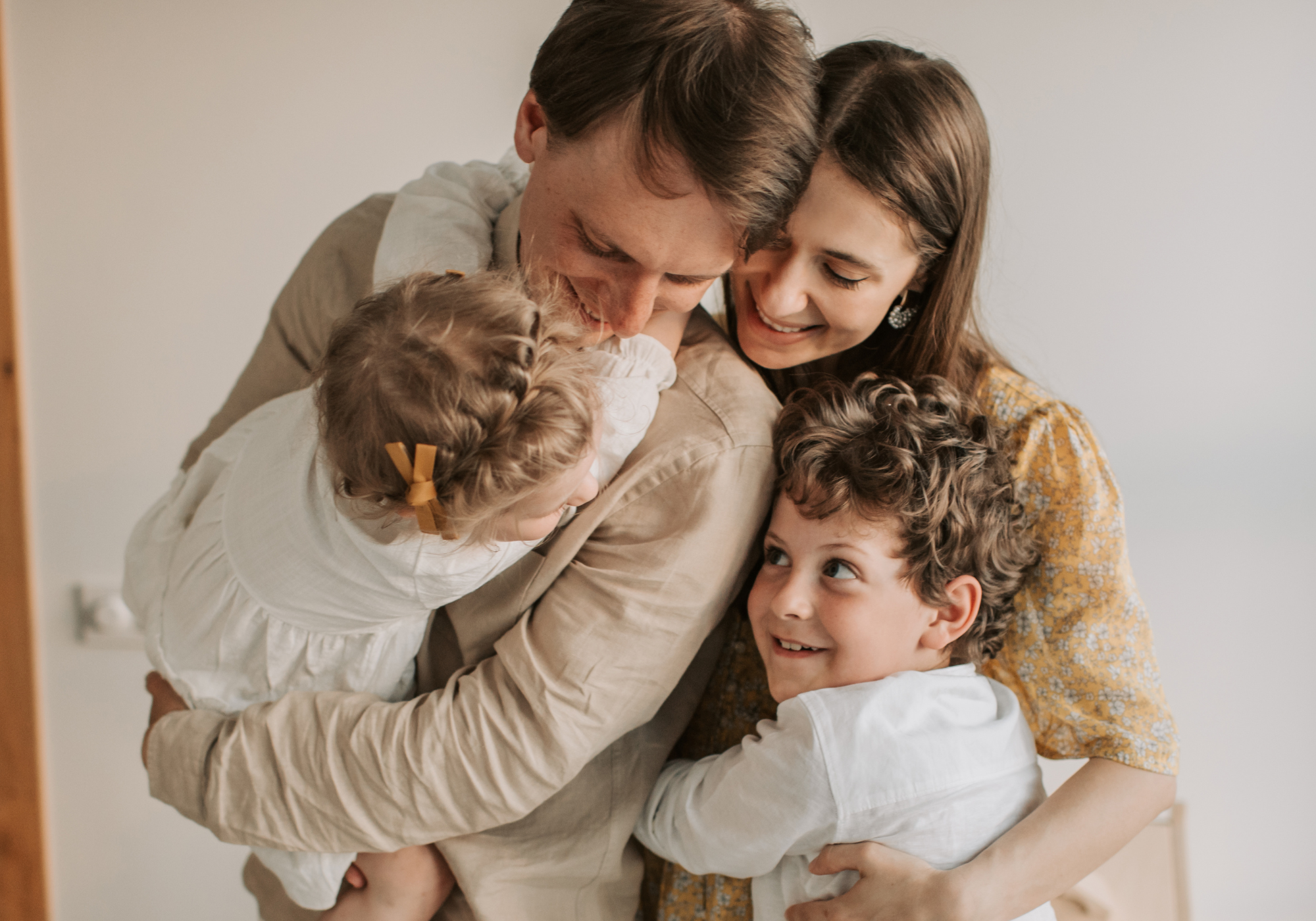 Happy family smiling together, proud members of The Police Credit Union enjoying trusted financial support.